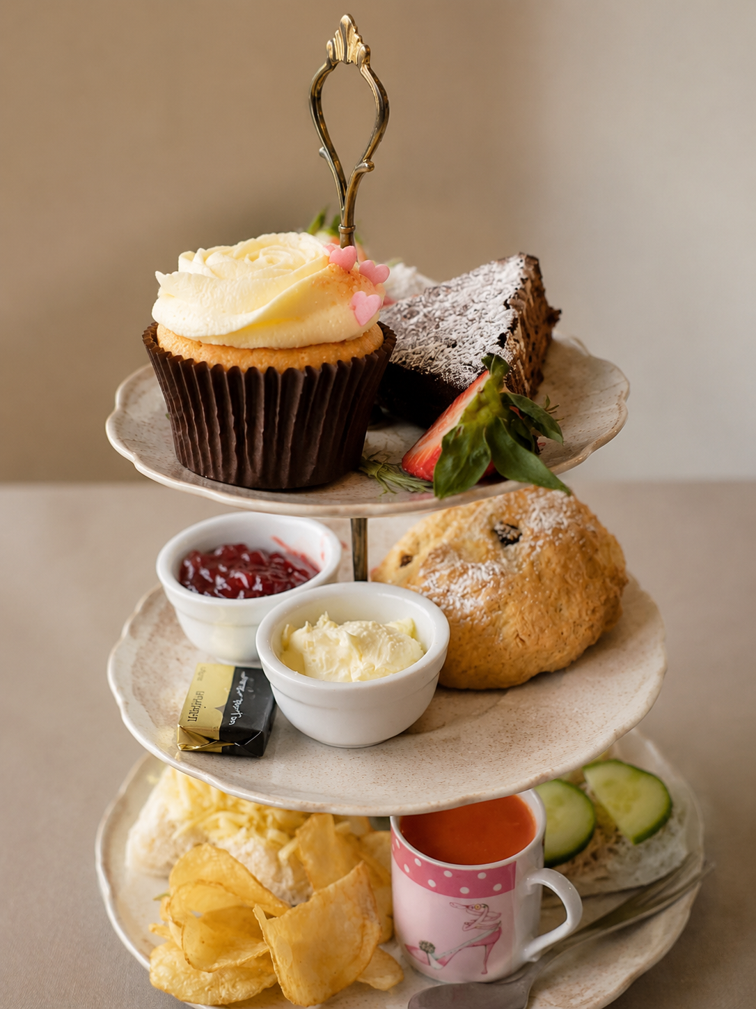 Two tier afternoon tea with cakes and savouries
